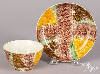 An unusual rainbow spatter cup and saucer
