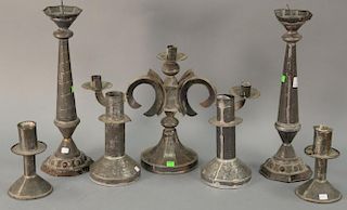 Three pairs of tin candlesticks and a tin candelabra. ht. 6 3/4in., 9 1/2in., & 17in.