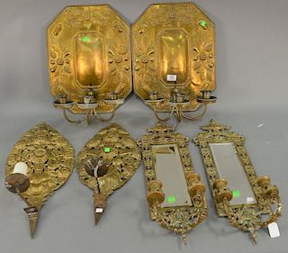 Three pairs of brass candle sconces to include to pairs of embossed brass and pair of Victorian mirrored sconces. ht. 18in., 