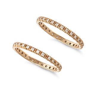 A PAIR OF DIAMOND ETERNITY RINGS in 18ct yellow gold, each set with a row of round brilliant cut ...