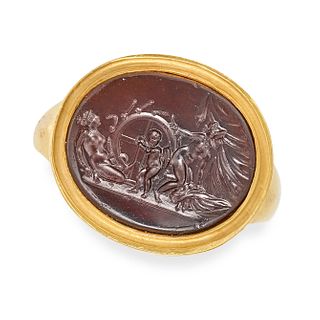 AN ANTIQUE EROTIC INTAGLIO RING in 18ct yellow gold, set with an intaglio depicting an erotic sce...