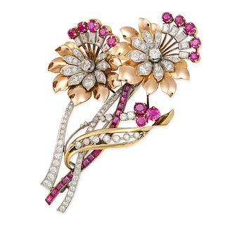 A RETRO RUBY AND DIAMOND FLOWER BROOCH in yellow and white gold, designed as two flowers set with...
