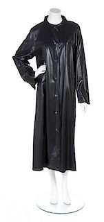 A Geoffrey Beene Black Raincoat,