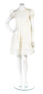 A Jane Prendiville Ivory Smocked Cotton Sundress,