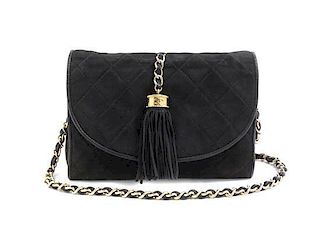 * A Chanel Black Quilted Suede Bag, 8 x 6 x 2 inches.