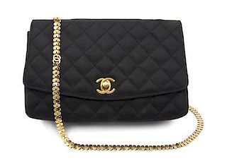 A Chanel Black Satin Quilted Flap Bag, 8 x 5 1/2 x 2 inches.
