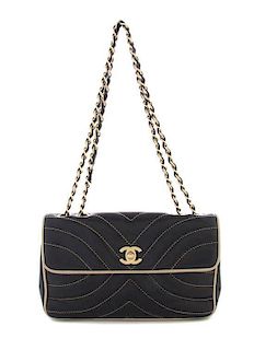 A Chanel Navy Chevron Quilted Leather Bag, 9 1/2 x 5 x 2 inches.
