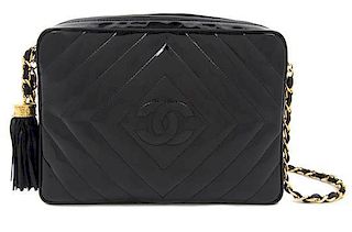 A Chanel Black Patent Leather Camera Bag, 9 x 6 1/2 x 3 inches.