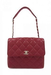 A Chanel Red Caviar Leather Cross Body Flap Bag, 9 x 6 1/2 x 3 inches.