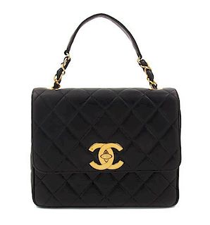 A Chanel Black Lambskin Giant CC Cross Body Flap Bag, 10 x 8 x 4 inches.