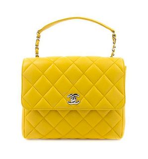 A Chanel Yellow Caviar Leather Cross Body Flap Bag, 9 1/2 x 7 1/2 x 3 1/2 inches.