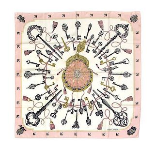 * An Hermes Pink and White Silk Scarf, 34 1/2 x 34 1/2 inches.