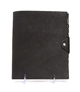 An Hermes Black Leather Address Book, 9 x 7 x 1 inches.