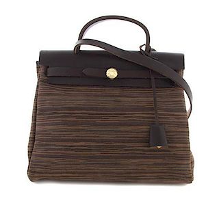 An Hermes 32cm Chocolate Brown Leather Vibrato Herbag 2-in-1 Bag, 11 1/2 x 9 x 5 inches.