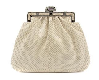 A Judith Leiber Ivory Karung Snakeskin Bag, 7 x 6 x 1 inches.