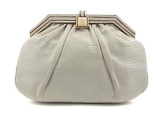 A Judith Leiber Ivory Snakeskin Bag, 9 x 7 x 1 1/2 inches.