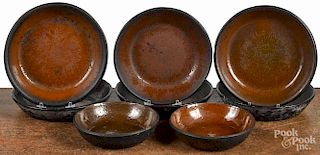 Eight redware shallow bowls, 19th c., 6'' - 8 1/4'' dia.