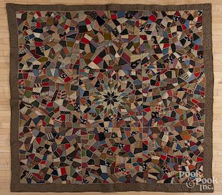 Victorian crazy quilt with a central star, 81'' x 80''.