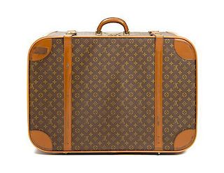 A Louis Vuitton Monogram Canvas Softsided Suitcase, 29 x 20 1/2 x 9 inches.