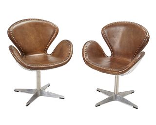 A pair of industrial-style swivel chairs