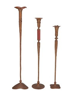 Gregg Hessel (b. 20th century), Three Hessel Studios hammered copper candlesticks, late 20th century, Largest: 25.25" H x 5" W X 4.5" D; smallest: 19.