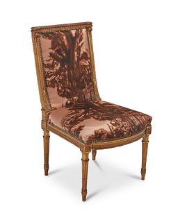A Louis XVI-style gilt wood chair upholstered with Prada fabric