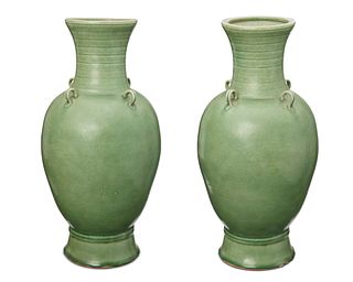 A pair of Chinese green ceramic vases