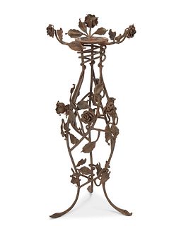 A wrought iron floral plant stand