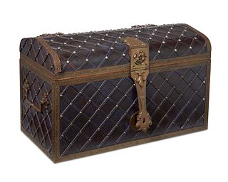 A Renaissance-style oxblood leather trunk