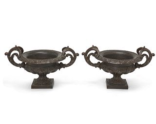 A pair of cast iron and copper jardiniEres
