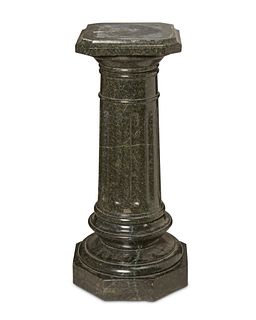 A green marble pedestal