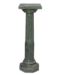 A green marble pedestal