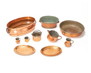A group of copper table items