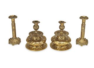 A group of brass candlesticks
