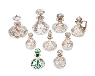 A group of sterling silver overlay perfume bottles