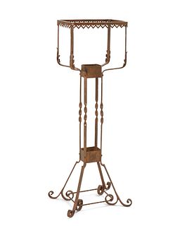 A wrought iron fish bowl stand