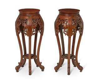 A pair of Chinese carved wood plant stands