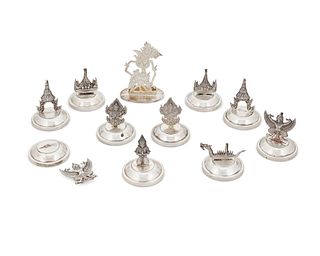 A group of Thai sterling silver place card holders