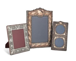 A group of silver picture frames