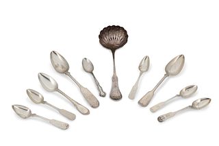 A group of silver flatware