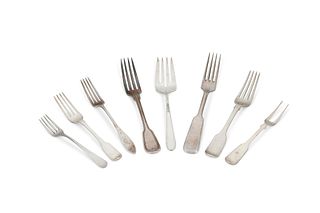 A group of silver forks