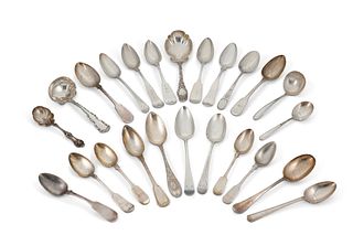 A group of sterling silver spoons