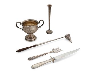A group of weighted silver items