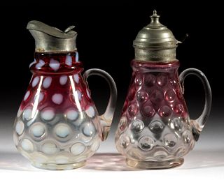 ASSORTED VICTORIAN RUBINA GLASS SYRUP PITCHERS, LOT OF TWO