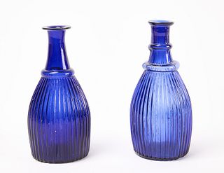 Two Ribbed Blown Glass Bottles