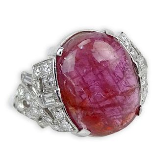 Lady's Art Deco Cabochon Ruby, 1.10 Carat Diamond and Platinum Ring. Ruby measures 15mm x 11.5mm. Diamonds