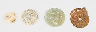 Group of Four Archaic Chinese Style Carved Hardstone Bi Disks