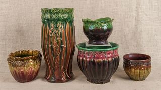 Four Majolica planters, together with an umbrella