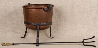 Twelve-gallon copper kettle with a wrought iron st