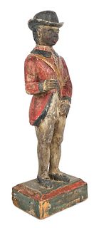 Carved and painted pine figure of a black soldier,